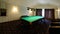 Billiard table in the hotel, sports game for relaxation.