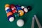 Billiard table with a selection of balls and cues Game. Snooker, billiards.