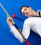 Billiard young man player lying on pool blue table