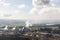 Billowing Smoke from Thermal Power Plant Stacks, Factory Exterior, and Active Open-Pit Mine in View