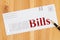 Bills word message on business envelope with pen