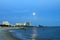 Biloxi, Mississippi, casinos and buildings in night image with rising moon