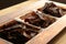 Biltong (dried meat) on a wooden board, this is a traditional food snack