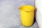 Bin plastic yellow color old for waste dump, empty bin for garbage waste on floor, dirty bin plastic, trash bin for recycle waste