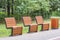 Bin for waste collection and three wooden benches