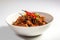 Binagoongan - a pork dish cooked with shrimp paste and chili peppers, generative AI Filipino dish