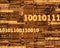 Binary code numbers on circuit board background