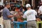 Bingo Caller outside with crowd in background