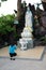 Binh Duong, Vietnam â€“ December 15, 2017: Young woman praying Buddha at Chau Thoi Mountain