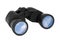 Binoculars with blue sky reflected on lenses