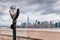 Binoculars on Ellis Island pointed towards Manhattan`s skyline i