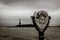 Binoculars in Ellis Island with view to the liberty statue new york