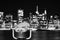 Binoculars pointed at Manhattan skyline at night, NYC.