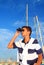 Binoculars teenager boy on boat marina