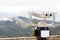 Binoculars telescope on observation deck for tourist. Coin operated electronic binoculars