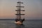 Binz, Germany - July 22, 2021 - The Loth LoriÃ«n is a three-masted barquentine flying the Dutch flag at dusk