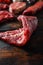 Bio Flank bavette or flap steak beef t steak near tri-tip and top blade oyster cuts close up in front of other cuts in butchery on