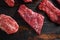 Bio Flank bavette or flap steak beef t steak near tri-tip and top blade oyster cuts close up in front of other cuts in butchery on