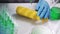 Bio scientist in gloves injects green solution or substance in genetically modified corn in the laboratory