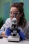 Biochemistry doctor examining chemical test using microscope