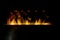 Bioethanol fireplace detail flames on black background