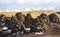 Biofuel mountains on the background of a mountain landscape