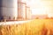 Biofuel storage green ecological biodiesel biogas gasoline gas fuel tanks grain silo tower wheat field agriculture