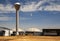 Biogas facility symbol of alternative energy with water tower