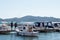 Biograd Croatia August 2020 Small old fishing boat with an older man on it, two people standing in front and watching. Traditional