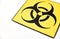 Biohazard caution sign on white background