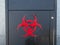 Biohazard spray painted logo on an outdoor steel container