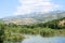 The Biokovo mountains and the Zrmanja river inland near  the Muskovici waterfall,  in Croatia