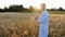 biologist agronomist, in a wheat field, at sunset, with a test tube in his hands