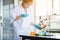 Biologist asian woman working with medical chemicals sample test at laboratary