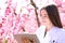 Biologist checking flowers in springtime in a field