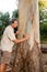 Biologist examine the bark of a Eucalyptus tree