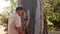 Biologist examine the bark of a Eucalyptus tree