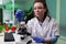 Biologist expert woman analyzing genetically modified leaf sample