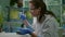 Biologist researcher using micropipette and petri dish