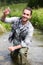 Biologist take a sample in a river in order to do some test