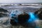 Bioluminescent tide glows on some rocks in La Jolla, California