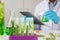 Biotechnology Doctor using tablet and check with biofuel industry project, Algae research in industrial laboratories for medicine