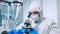 Biotechnology scientist in ppe suit researching DNA