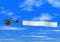 Biplane pulling banner on Sky Background
