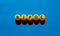 BIPOC symbol. Abbreviation BIPOC, black, indigenous and people of color on tennis balls. Beautiful blue background. Copy space.