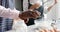 Biracial couple wearing aprons and baking in kitchen, slow motion