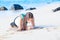 Biracial teen girl exercising on tropical beach, planking