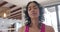 Biracial woman doing yoga and stretching at home, slow motion