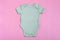 Birch blank baby bodysuit template, mock up close-up on pink background. Baby bodysuit, jumpsuit for newborns. View from above