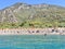 Birch, clear sea and mountains on the horizon. An ideal place for a seaside holiday. In the distance, a Mediterranean beach, view